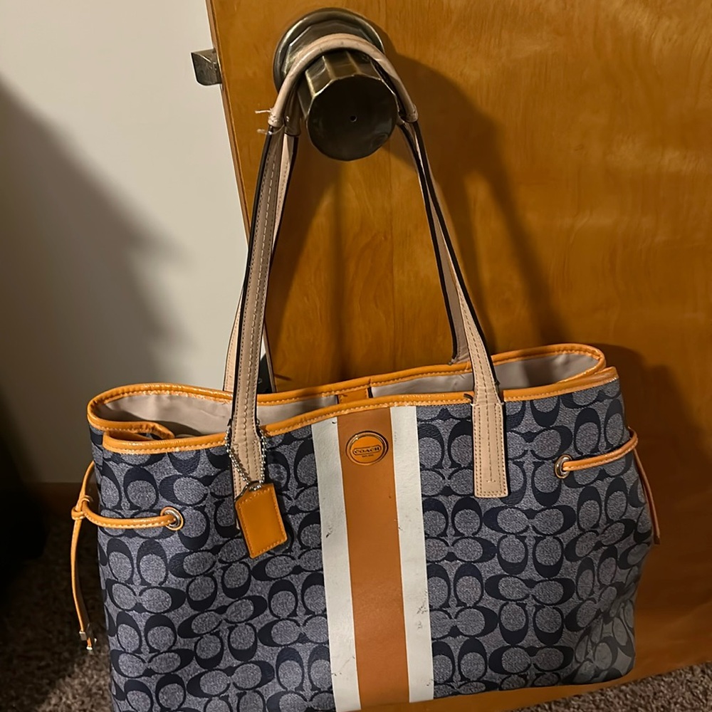 A well used traditional Coach Tote